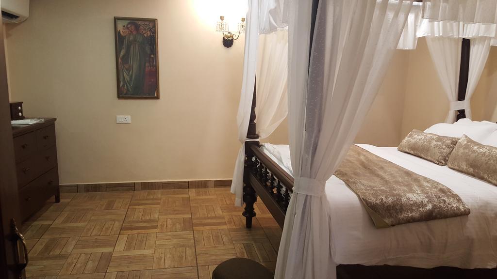 Casa Menezes - A Heritage Goan Homestay Bambolim Værelse billede
